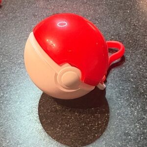 Red and White Poké Ball Toy with a mystery Pokémon inside